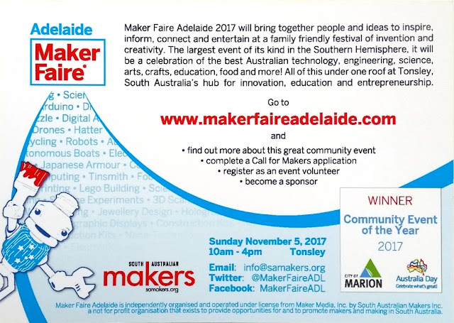 The back of the Maker Faire postcard. Mascot "Sam" the robot is in the bottom left corner holding up a paintbrush daubed with red paint. Top left corner has the heading "Adelaide Maker Faire". Next to the heading is the following black text on a white background quoted in the body of the blog entry. Maker Faire Adelaide's web site address is in bold red letters in the centre. From the heading, a curve bordered by two blue bands sweeps down towards the bottom of the card and then up again towards the right edge. Some of the words within the blue section are: Science, Arduino, Digital A.., Drones, Hatter, Robots, ..tonomous Boats, Japanese Armour, Tinsmith, Computing, Lego Building, Experiments, 3D.., Jewellery Design, Hologram..words fade into a screen of pale blue onto which the followoing details are printed: South Australian Makers logo, samakers.org, Sunday November 5, 2017 10am-4pm Tonsley; Email: info@samakers.org; Twitter: @MakerFaireADL; Facebook: MakerFaireADL; A box on the bottom right says "WINNER Community Event of the Year 2017 - City of Marion (logo), Australia Day Celebrate what's great (logo)