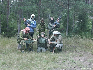 Terrorists with a captured victim who has been blind folded Terrorists with a captured victim who has been blind folded