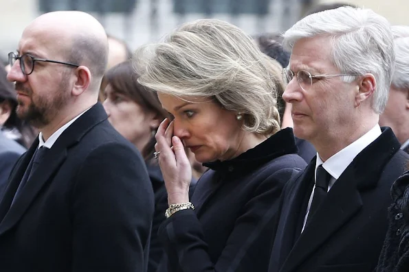 King Philippe of Belgium and Queen Mathilde of Belgium hold a minute of silence during