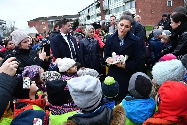 Crown Princess Victoria of Sweden visited Helsingborg Municipality and Vera industrial Park. She wore blue wool coat