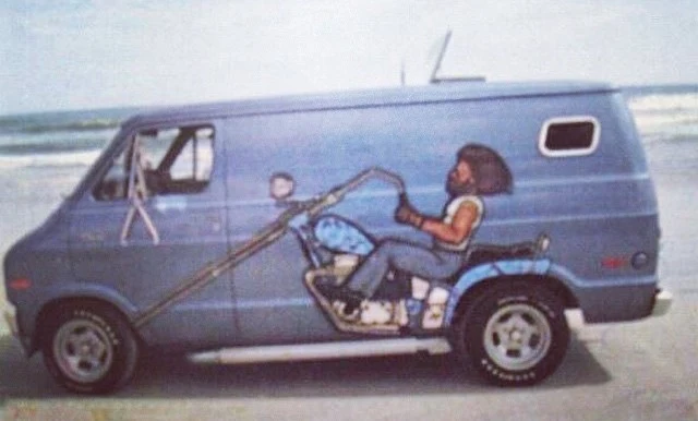 1970s day van with chopper motorcycle mural on the side.