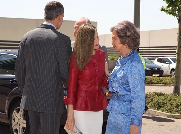 Queen Letizia wore Uterque red Leather jacket and Uterque beige pumps, Queen carried Uterque clutch bag, wore Hugo Boss skirt