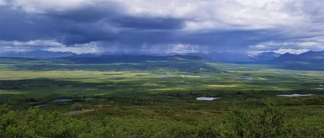 View of the valleys, dark clouds, and rain