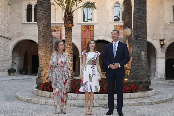 Queen Letizia and Former Queen Sofia host a dinner at the Almudaina Palace in Palma de Mallorca. Letizia wore Juan Vidal Floral dress, Malababa bag, Magrit sandals, Tous earrings