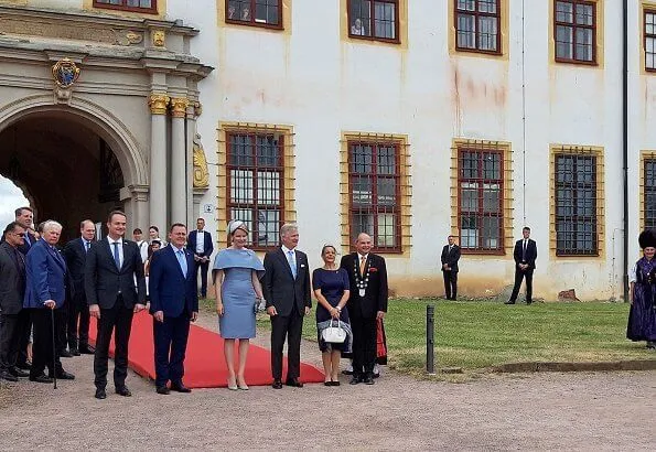 Queen Mathilde wore Natan grey cape dress. Thuringia and Saxony-Anhalt states of Germany. Erfurt-Weimar airport