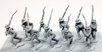 CL7 Confederate Infantry in Shell Jackets – Marching Marching Infantry in shell jackets with mix of slouch hat and kepi