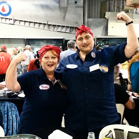 Two women dressed as Rosie the Riveter.