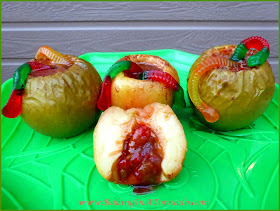 Caramel Ginger Baked Apples, for Halloween or any Fall day. Apples steamed with cinnamon and ginger are stuffed with a fun surprise and topped with a gummy worm | recipe developed by www.BakingInATornado.com | #recipe #Halloween #dessert