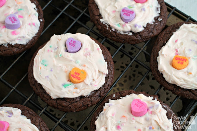 Fudgy & chewy brownie cookies are topped with an easy to make conversation heart frosting in these Conversation Heart Frosted Brookies.