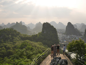 people taking photographs on Bright Moon Peak at Diecai HIll (叠彩山) in Guilin