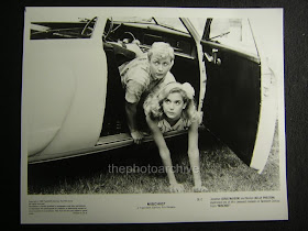 Mischief 1985 original lobby card Kelly Preston and Doug McKeon falling out of their car movieloversreviews.filminspector.com