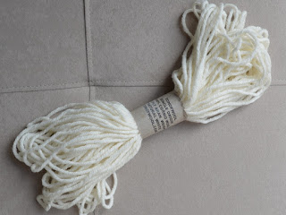 A small sample skein of 100% cormo wool.