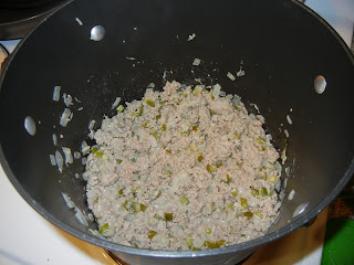 onion, peppers, and ground turkey browned in a pot 
