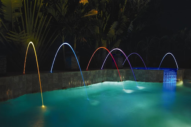 swimming-pool-with-water-fountains-with-lights.