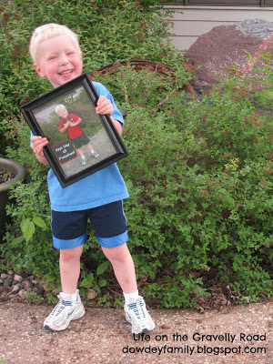 Last day of school holding picture of first day of school