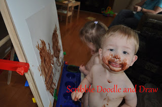 Toddler art activity painting with pudding
