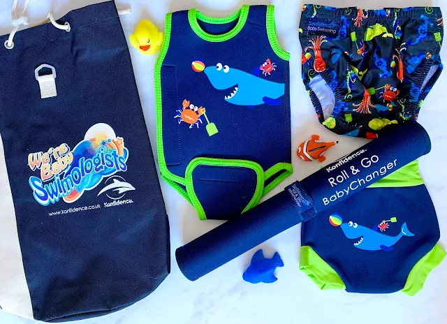 Konfidence Baby Swimming kit including a babywarma with shark design, nappies and pool side changing mat