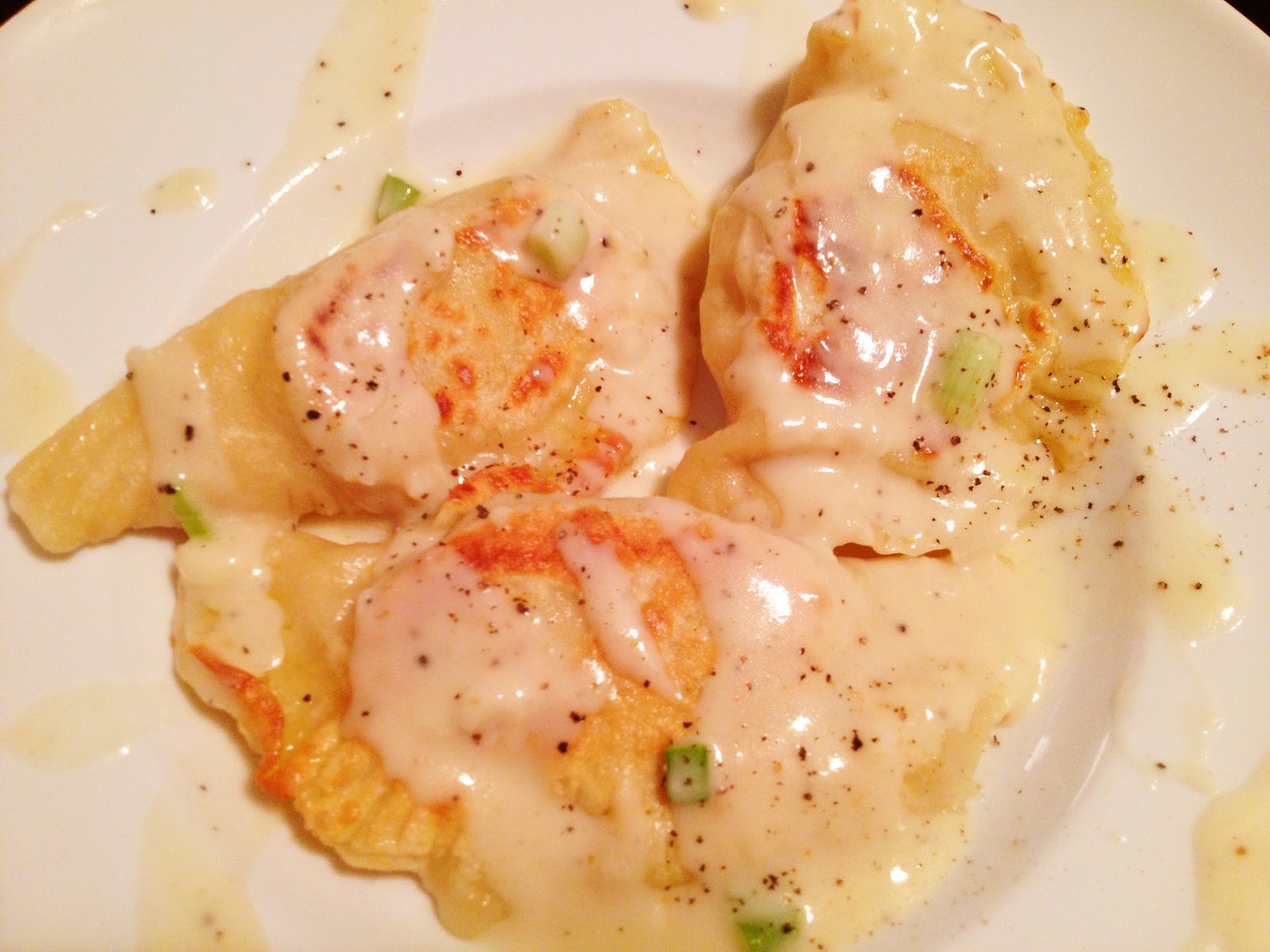 Potato and Cheese Pierogi with Sour Cream GarlicChive Sauce