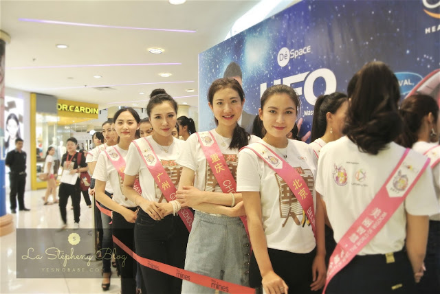 all female participants of the Miss Chinese World 2017 queuing behind stage nervously to wait for the start of Gintell event