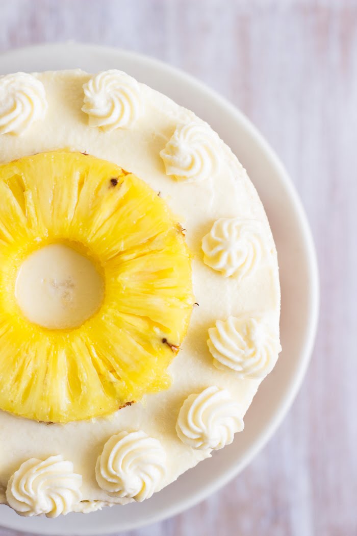How to make eggless pineapple cake recipe, whipped cream frosting, eggless vanilla sponge cake, eggless cake recipe, vegetarian pineapple cake at www.oneteaspoonoflife.com One Teaspoon Of Life