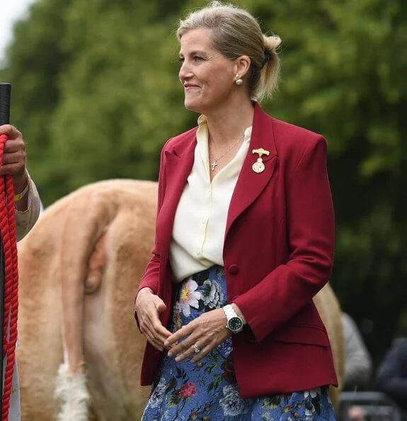 Countess of Wessex wore a floral-print crepe midi skirt by Erdem, Alexander McQueen slim fit blazer, pearl earrings