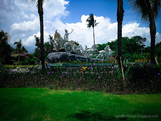 Sweet Garden Landscape With Krishna's Chariot Statue Of The Ecopark At Tangguwisia Village, North Bali, Indonesia