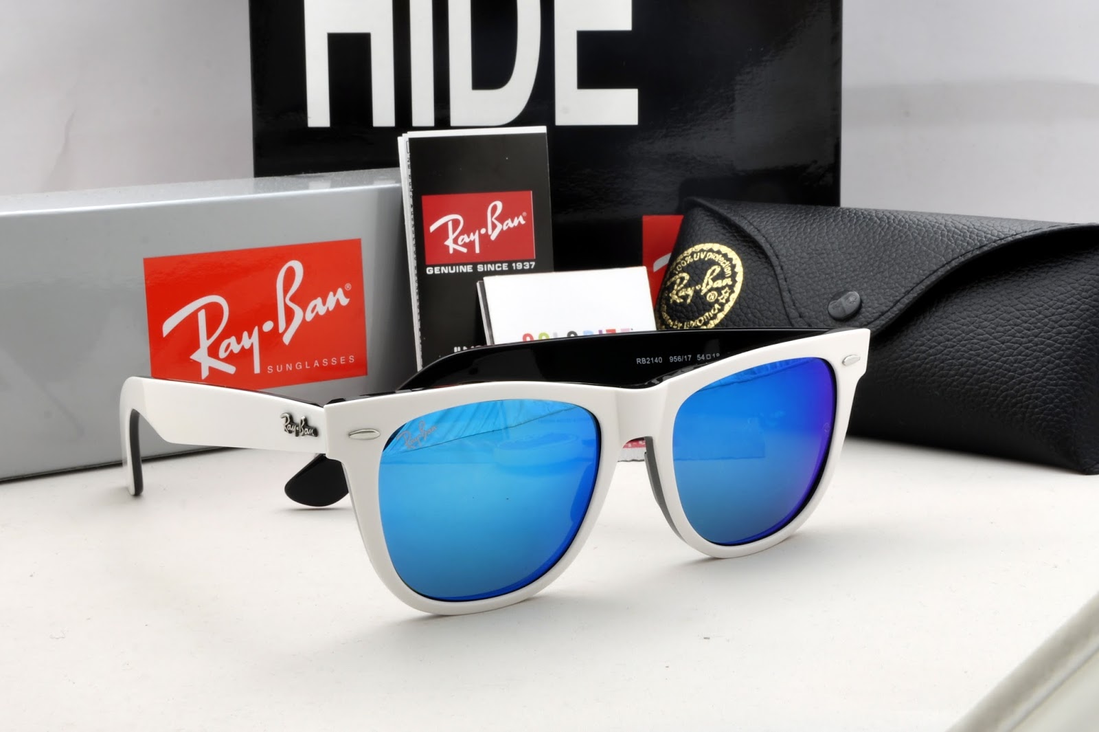 white ray bans with blue lenses