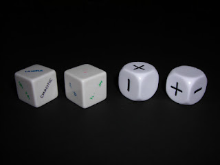 Two faded alignment dice and two Fudge dice.