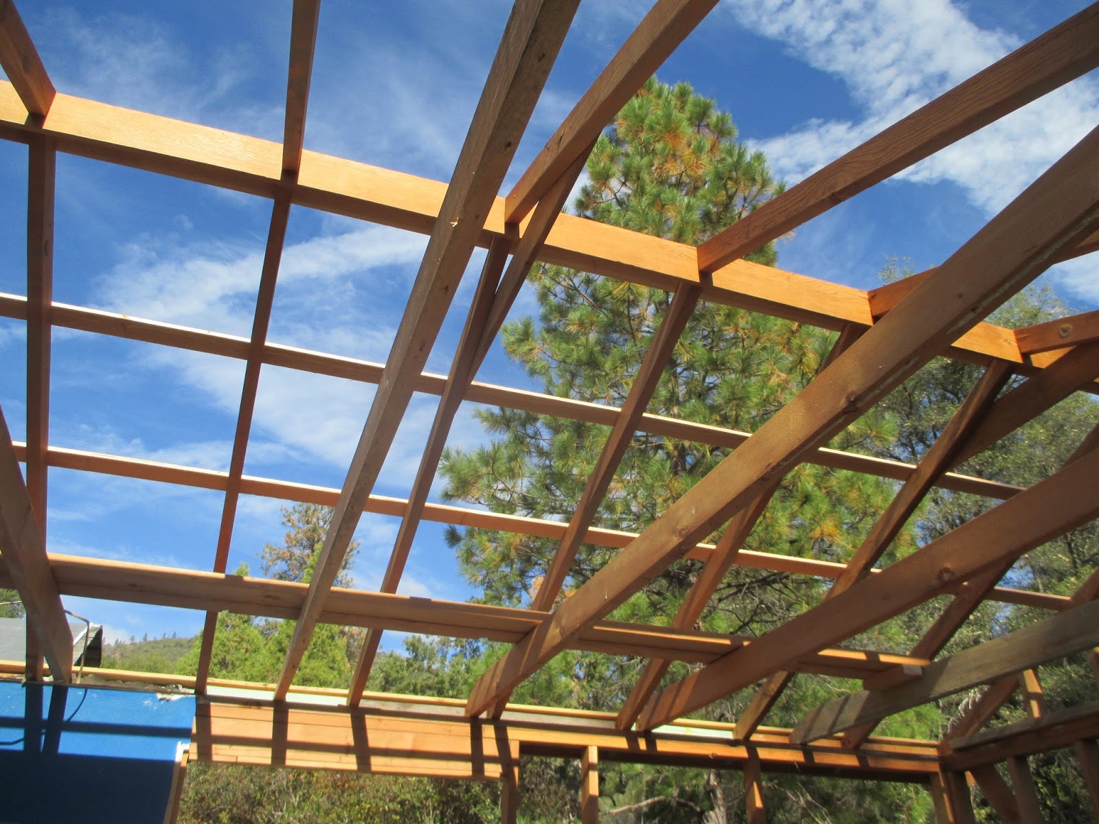 triangle greenhouse (purlins, roof panels, and stucco removalsouth