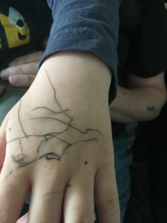 scribble-on-toddlers-hand