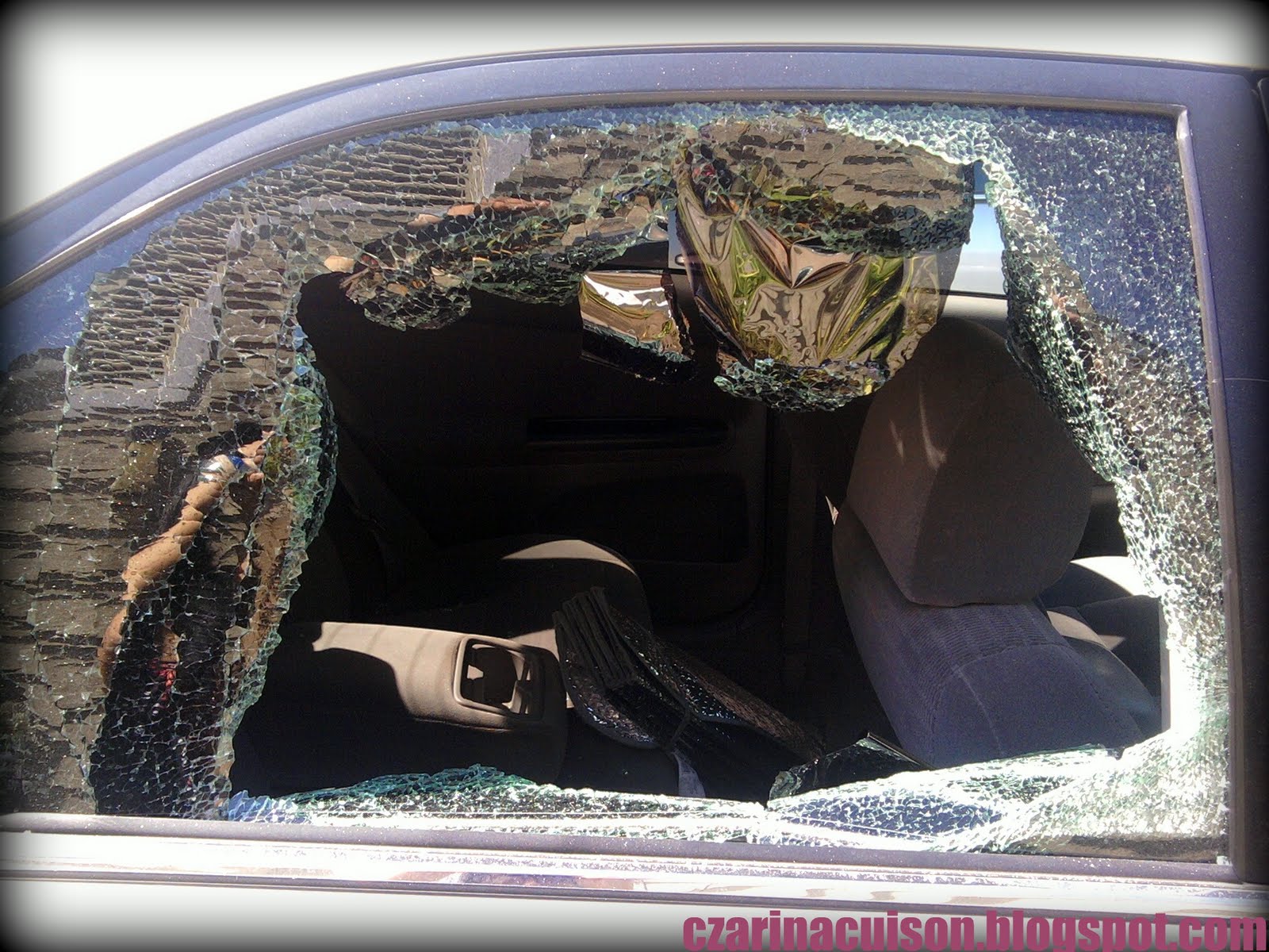 Czarina C. Broken car window.