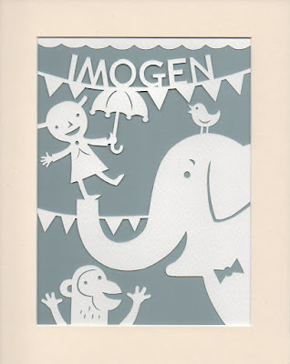 papercut picture of elephant and monkey and child