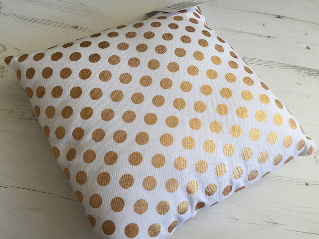 white and gold spot cushion primark