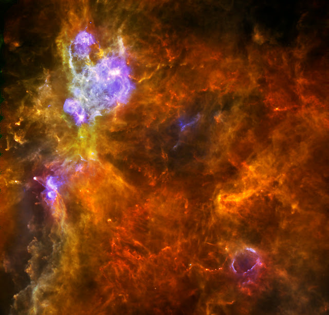 W3 is an enormous stellar nursery about 6,200 light-years away in the Perseus Arm, one of the Milky Way galaxy’s main spiral arms, which hosts both low- and high-mass star formation. In this image from the Herschel space observatory, the low-mass forming stars are seen as tiny yellow dots embedded in cool red filaments, while the highest-mass stars - with greater than eight times the mass of our Sun - emit intense radiation, heating up the gas and dust around them and appearing here in blue.   This three-color image of W3 combines Herschel bands at 70 microns (blue), 160 microns (green) and 250 microns (red). The image spans about 2 by 2 degrees. North is up and east is to the left.   Image Credit: ESA/PACS & SPIRE consortia, A. Rivera-Ingraham & P.G. Martin, Univ. Toronto, HOBYS Key Programme (F. Motte) Explanation from: http://www.nasa.gov/mission_pages/herschel/multimedia/pia16881.html