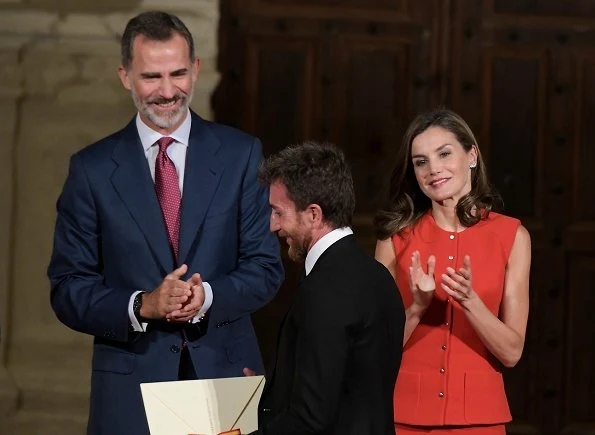 Queen Letizia wore a red dress from Nina Ricci, Prada pumps and carried Menbur  Malva clutch at award ceremony