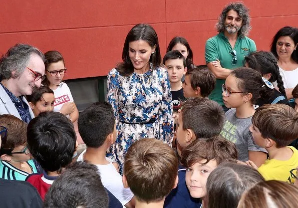 Queen Letizia wore Sandro all-over print long silk dress. Queen Letizia wore Carolina Herrera nude patent leather slingback pumps