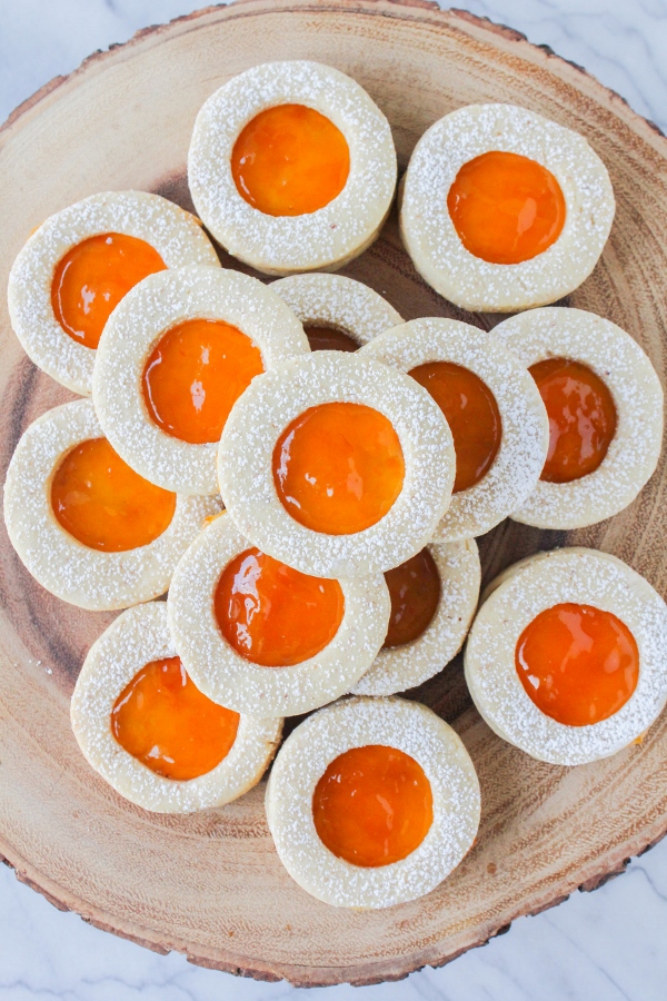 These beautiful, buttery almond shortbread cookies are sandwiched between a light and fresh apricot jam. These classic Linzer cookies are perfect for any of your spring special occasions!
