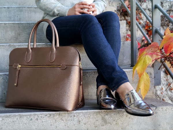 Gold saffiano leather bag from Roots and silver metallic 3.1 Phillip Lim loafers