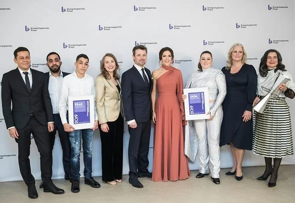 Crown Princess Mary wore a new bespoke gown by Danish fashion designer Soeren le Schmidt. Danish singer Jada, Emilie Molsted