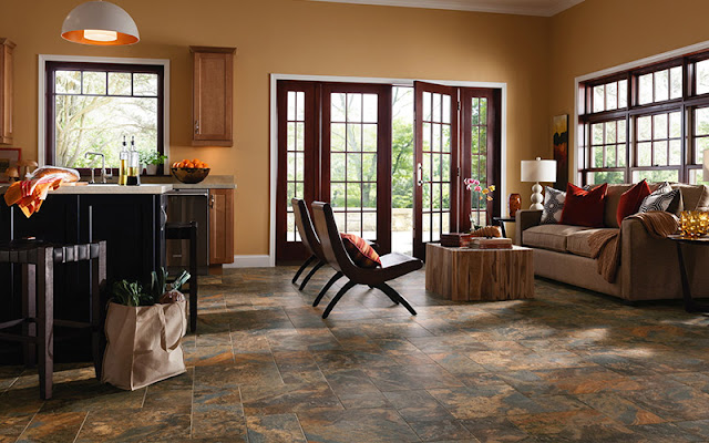 Beautiful tile flooring stands up to everything this kitchen/sitting area has to offer.