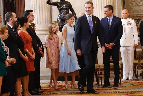 King Felipe, Princess Leonor and Infanta Sofia. Queen Letizia, blue dress, diamond bracelet, and diamond earrings