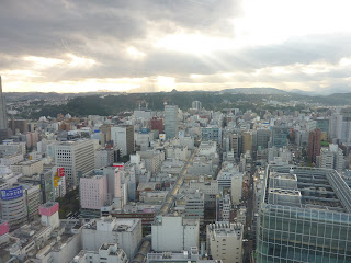 Photograph of Sendai from AER building with sun shining through clouds