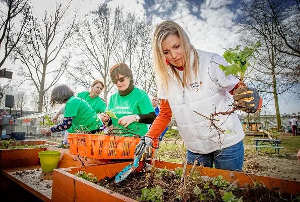 National Volunteer day, King Willem-Alexander and Queen Maxima volunteering for NL Doet in the neighborhood garden in Breda