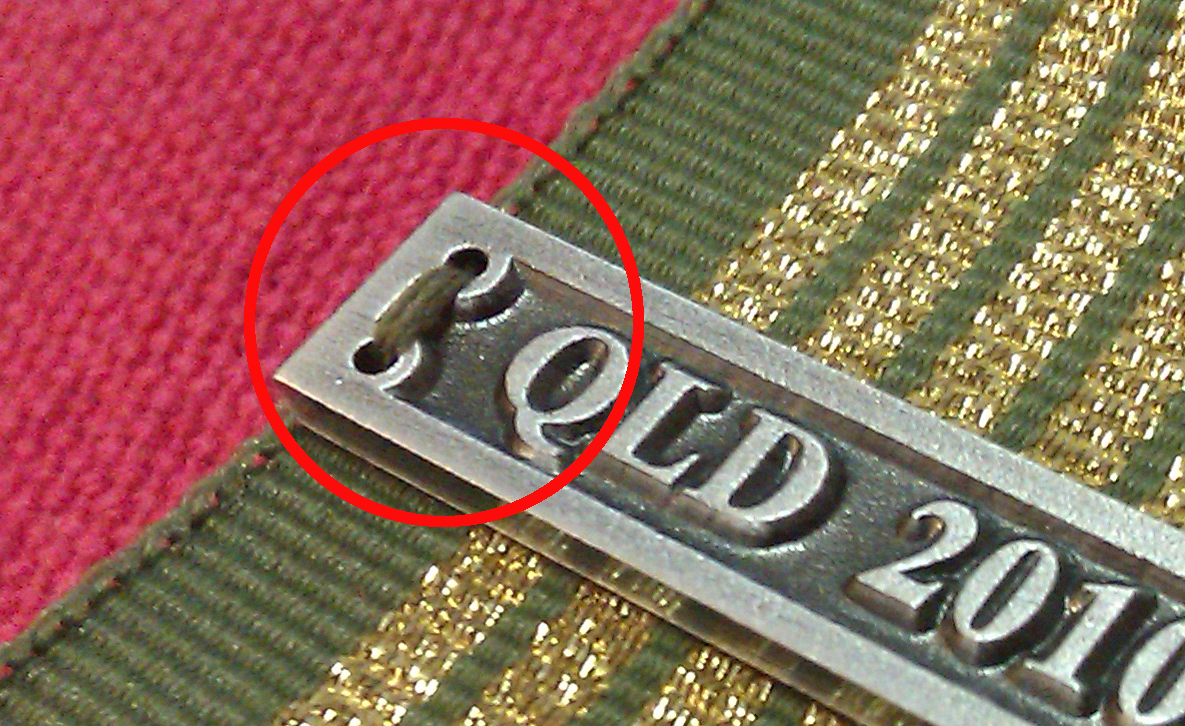 How to sew a clasp to a medal