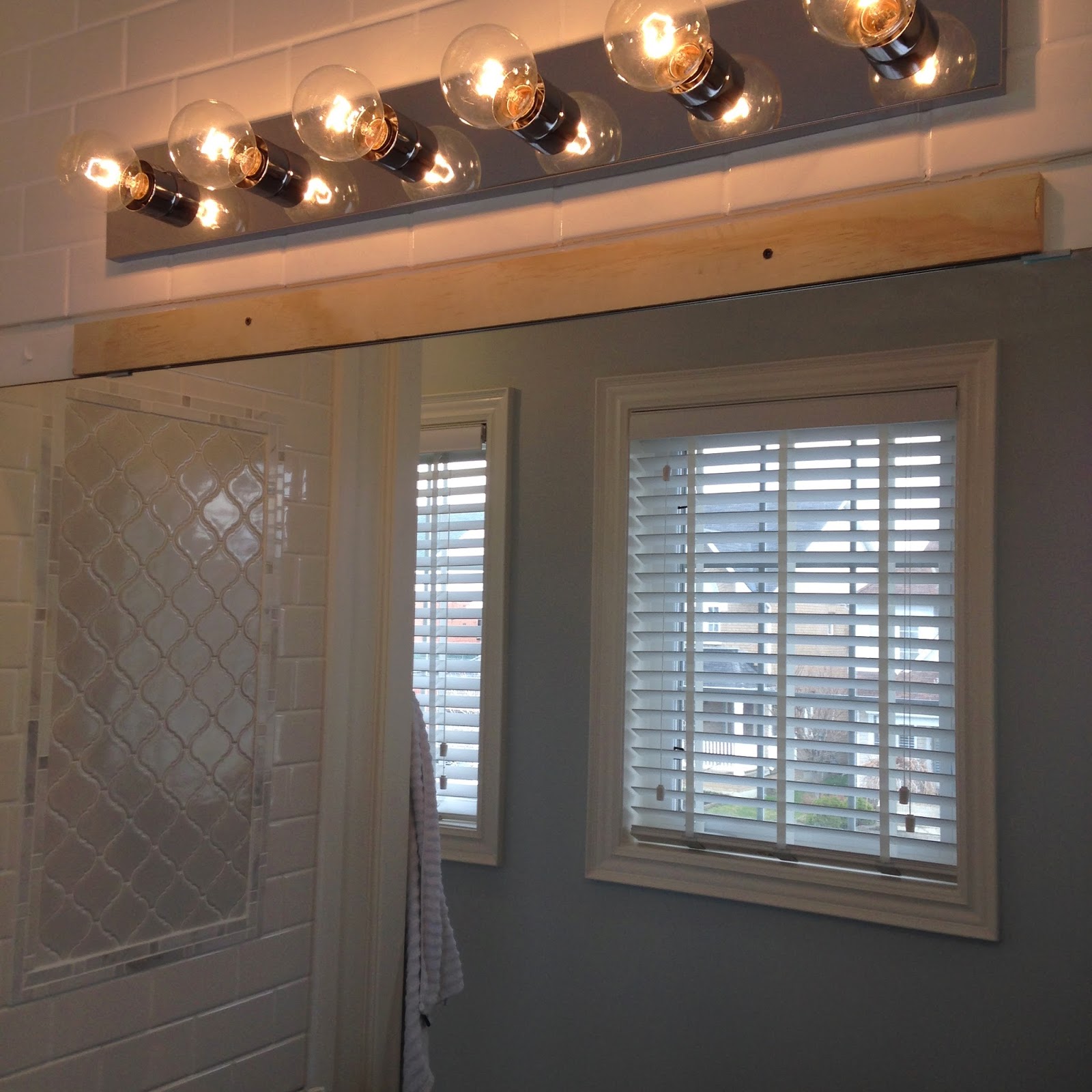 White Wood Weekend bathroom update...how to frame a bathroom mirror