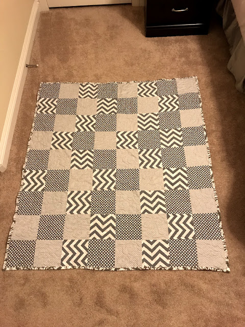 gray and white quilt