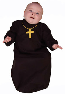 baby in priest costume