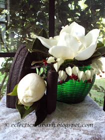 Eclectic Red Barn: Magnolia Blooms in Green Vase with Antique Iron