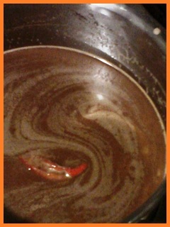 cayenne pepper floating inside chocolate mixture