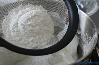 putting together sugar and flour for angel food cake for summer bread pudding